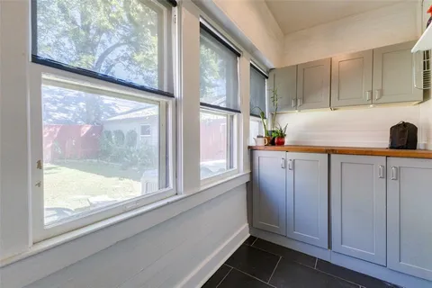 a kitchen with a window a sink and a refrigerator