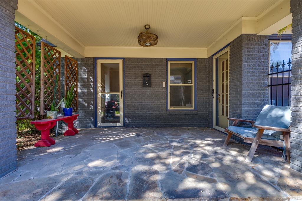 5407 Merrimac Avenue Dallas, TX 75206 - Photo 22 of 26 a backyard of a house with outdoor seating