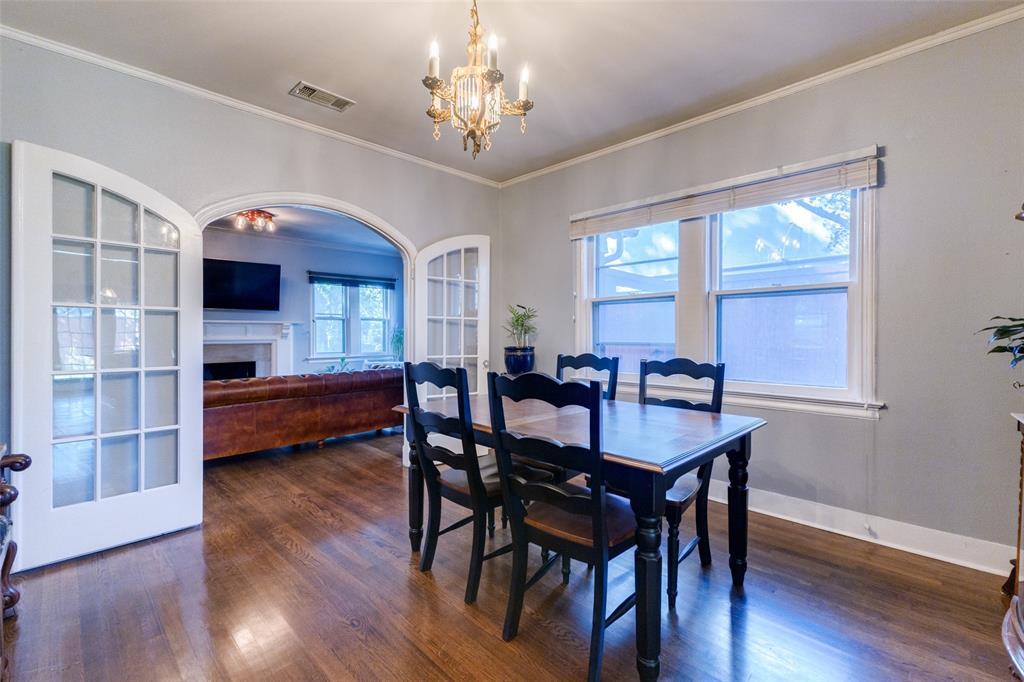 5407 Merrimac Avenue Dallas, TX 75206 - Photo 7 of 26 a view of a dining room with furniture and wooden floor