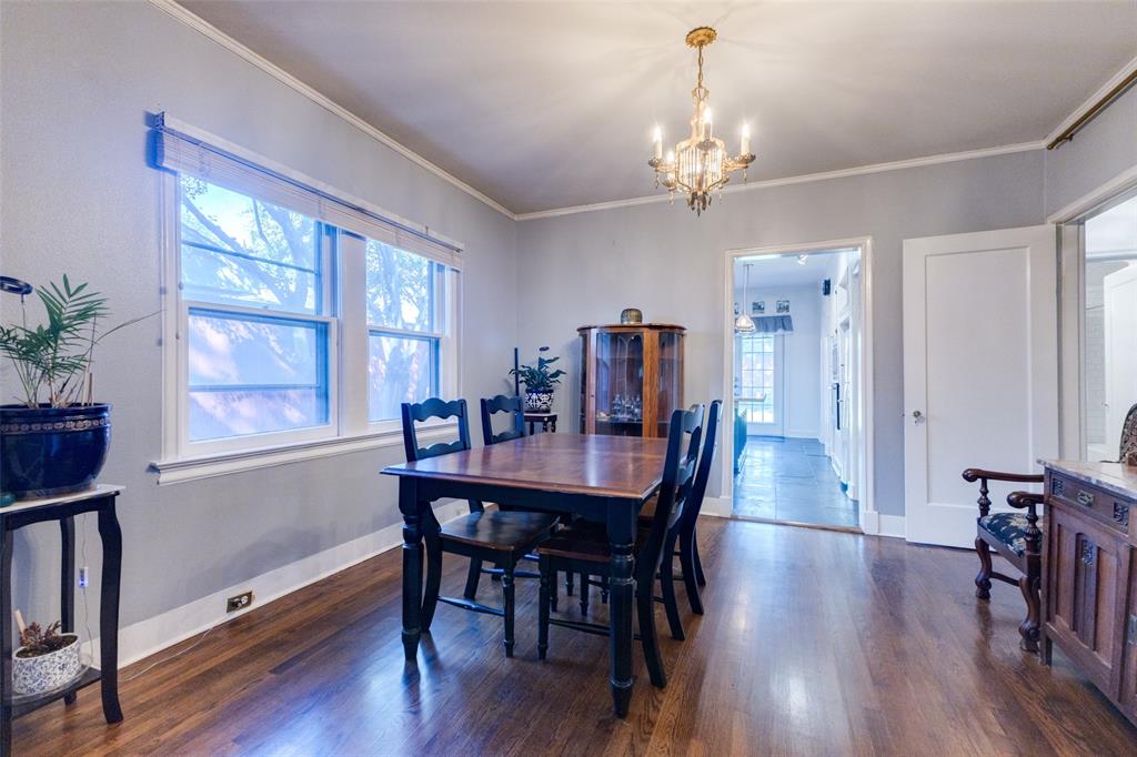 5407 Merrimac Avenue Dallas, TX 75206 - Photo 8 of 26 a view of a a dining room with furniture window and wooden floor