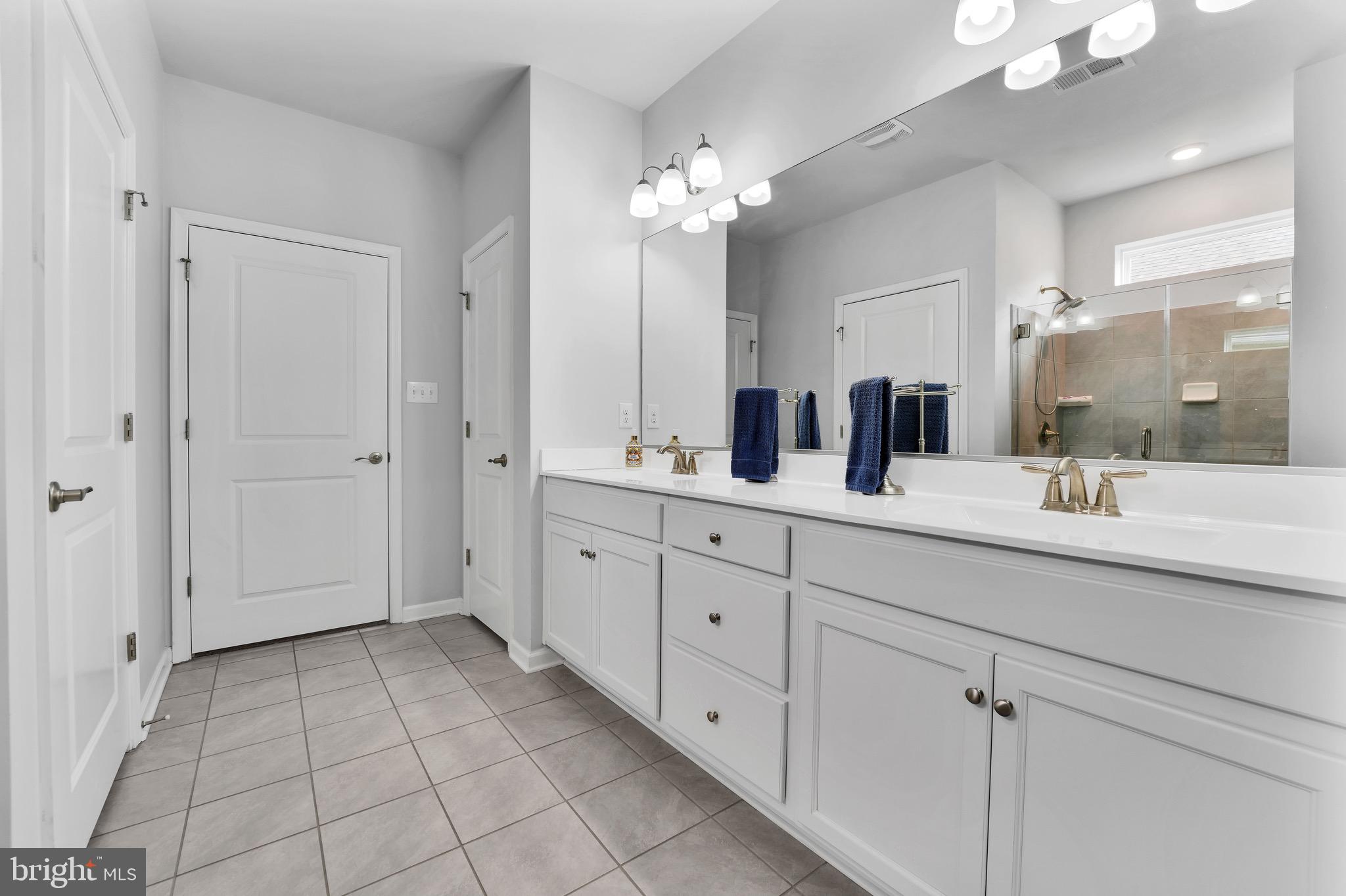 127 Raccoon Lane Barnegat, NJ 08005 - Photo 14 of 19 a spacious bathroom with a granite countertop sink a mirror and a