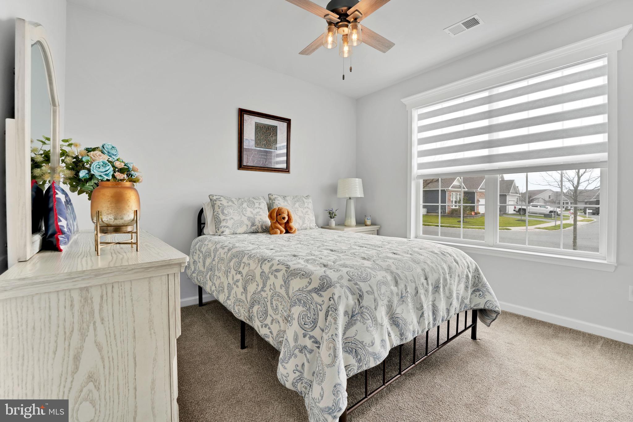 127 Raccoon Lane Barnegat, NJ 08005 - Photo 4 of 19 a bed sitting in a bedroom next to a window