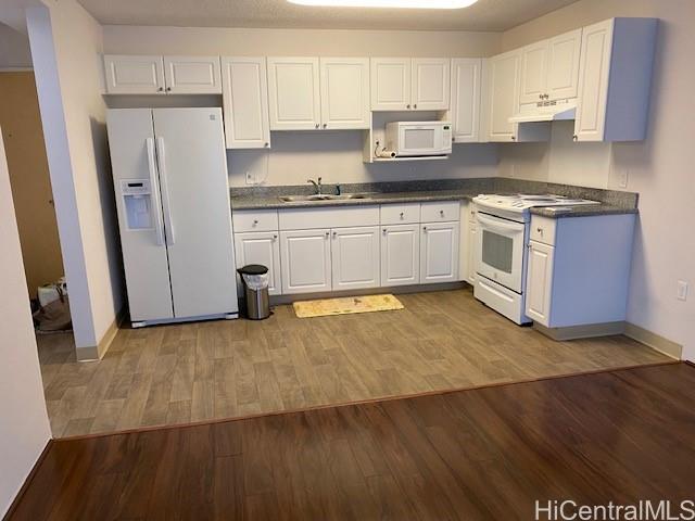 801 South Street, Unit 503 Honolulu, HI 96813 - Photo 11 of 12 a white kitchen with sink and stainless steel appliances