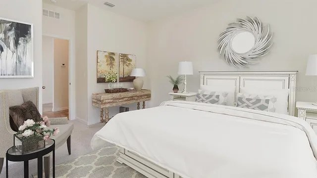 a bedroom with a bed and dresser with mirror