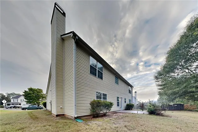 a house view with a backyard space