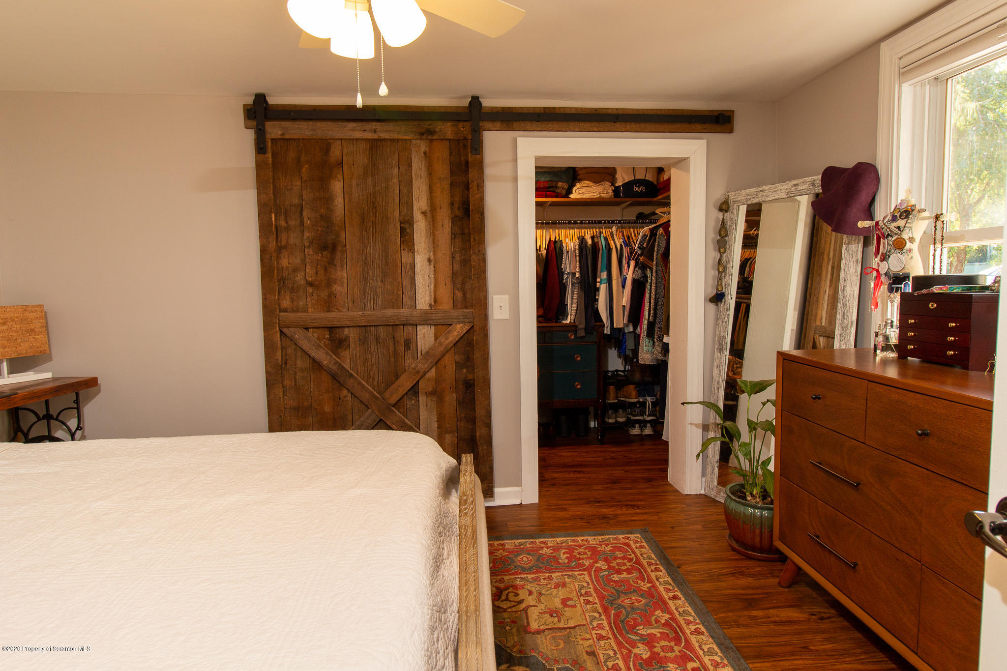 511 Meshoppen Creek Road Meshoppen, PA 18630 - Photo 14 of 30 a bed room with a bed and a mirror