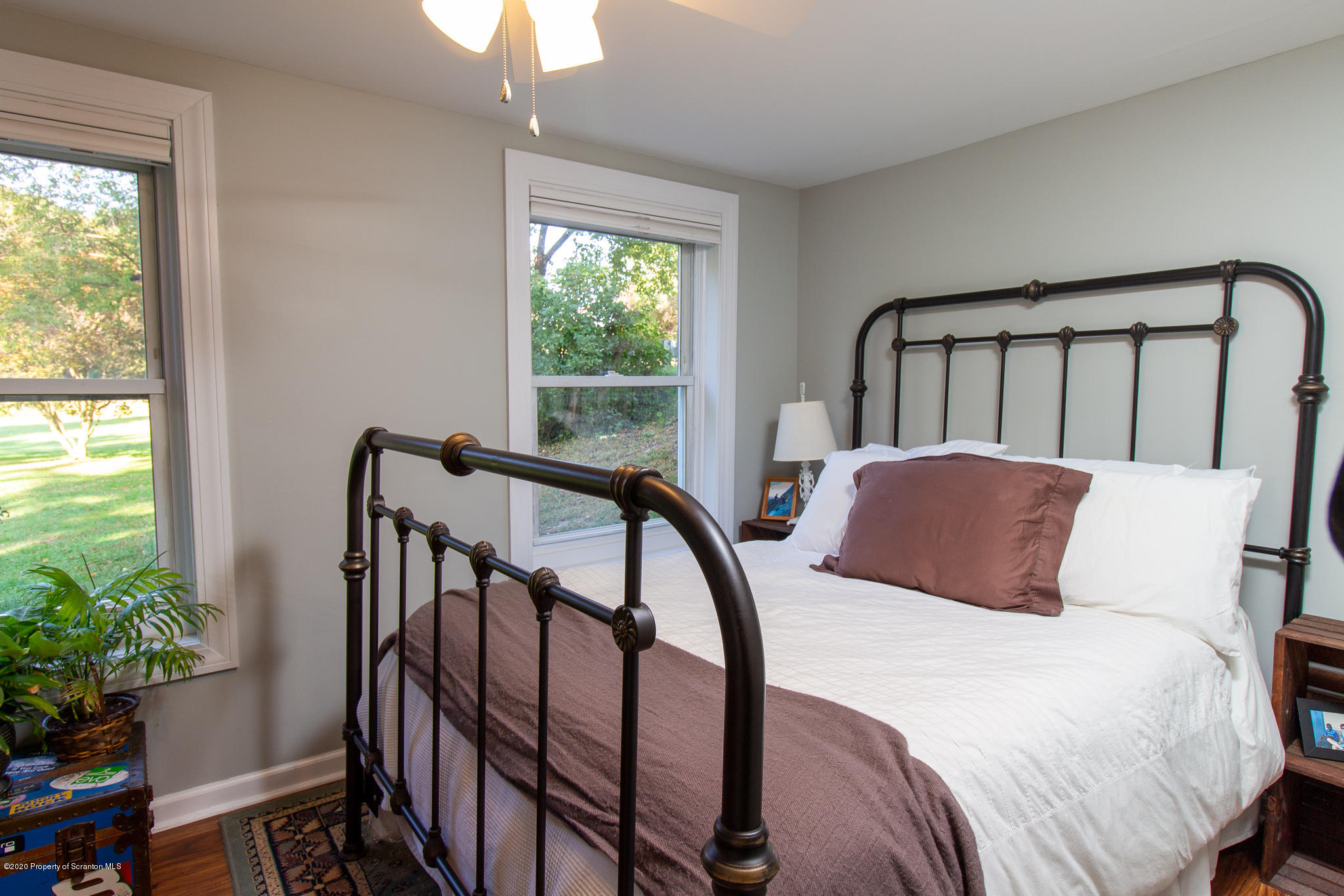 511 Meshoppen Creek Road Meshoppen, PA 18630 - Photo 15 of 30 a bedroom with a bed and a potted plant