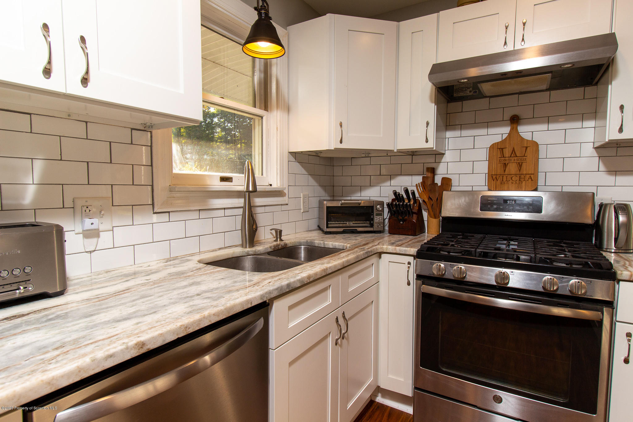 511 Meshoppen Creek Road Meshoppen, PA 18630 - Photo 2 of 30 a kitchen with stainless steel appliances granite countertop a sink and a stove