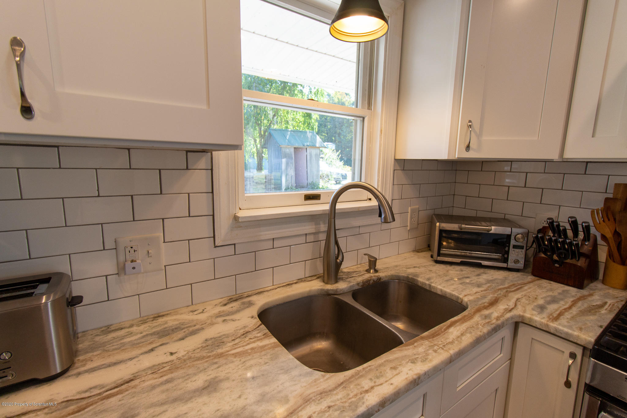 511 Meshoppen Creek Road Meshoppen, PA 18630 - Photo 5 of 30 a kitchen with a sink and a window