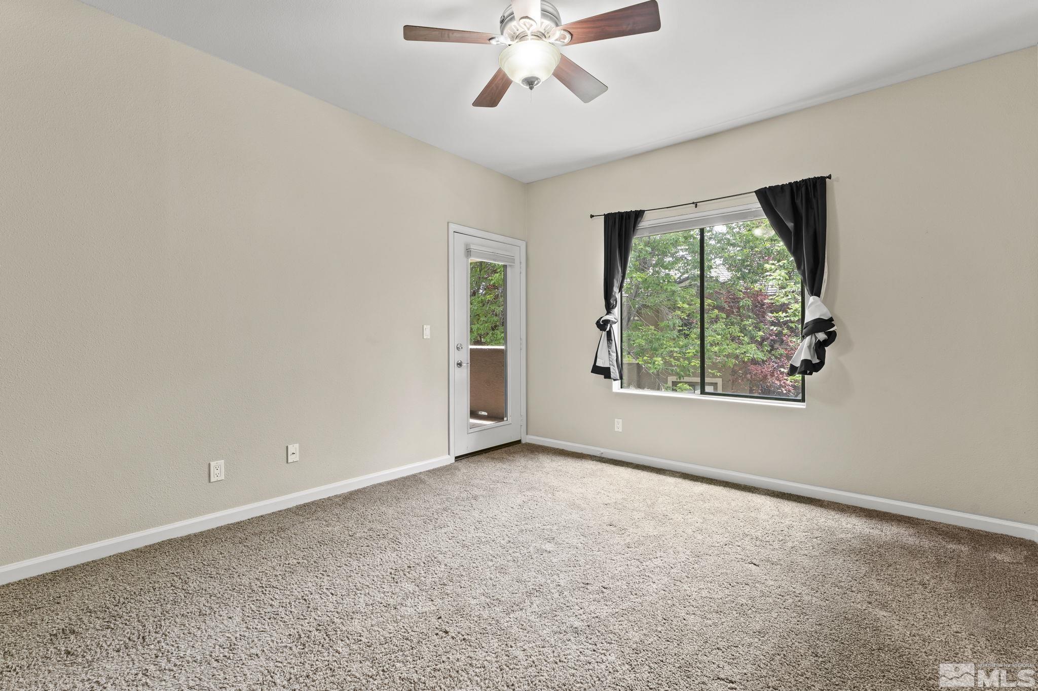 900 South Meadows Parkway, Unit 321 Reno, NV 89521 - Photo 15 of 40 an empty room with windows and ceiling fan