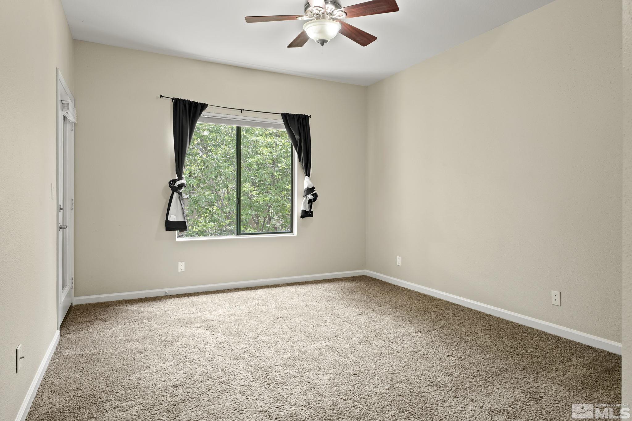 900 South Meadows Parkway, Unit 321 Reno, NV 89521 - Photo 17 of 40 an empty room with a window