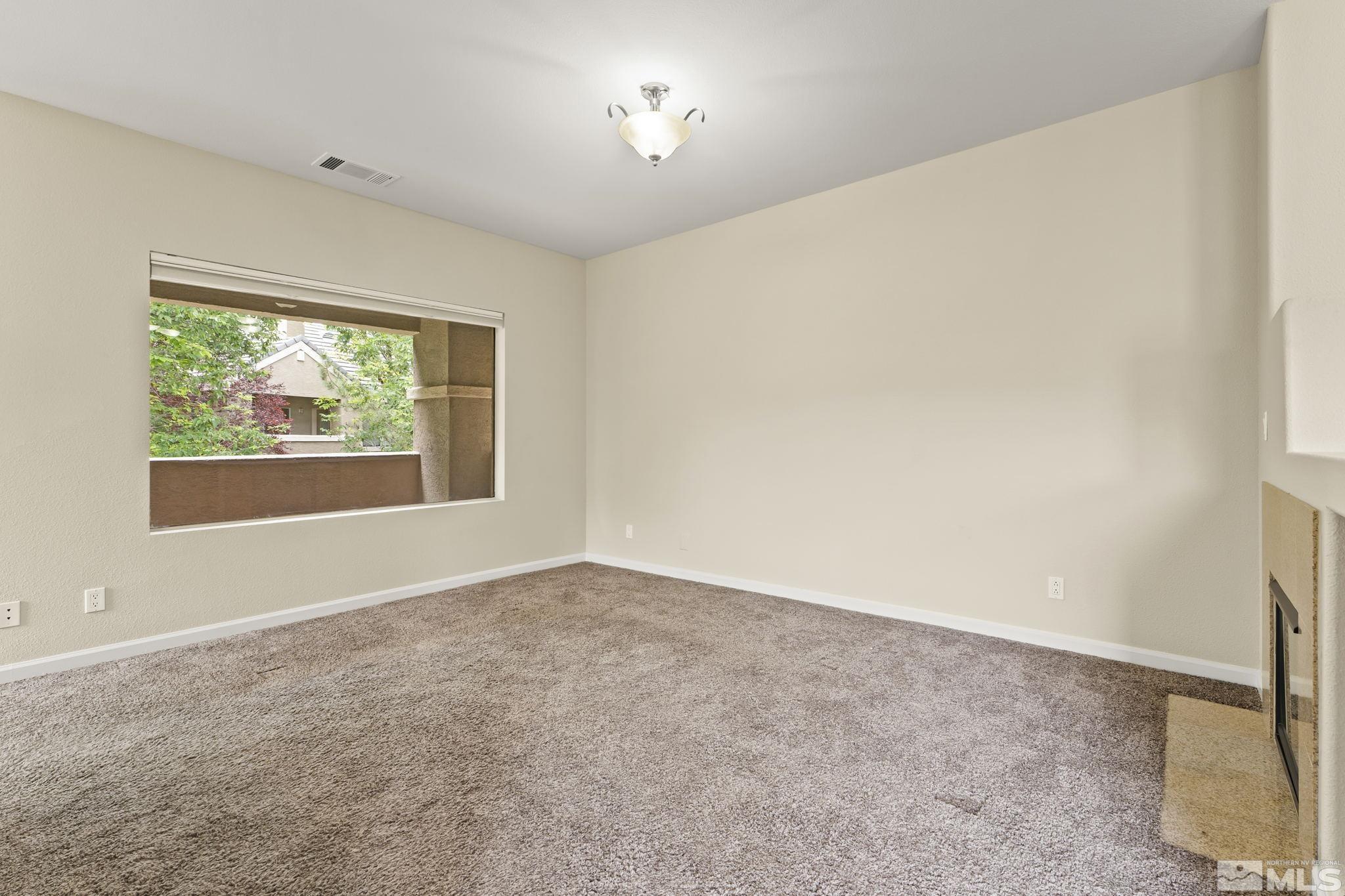 900 South Meadows Parkway, Unit 321 Reno, NV 89521 - Photo 26 of 40 an empty room with windows