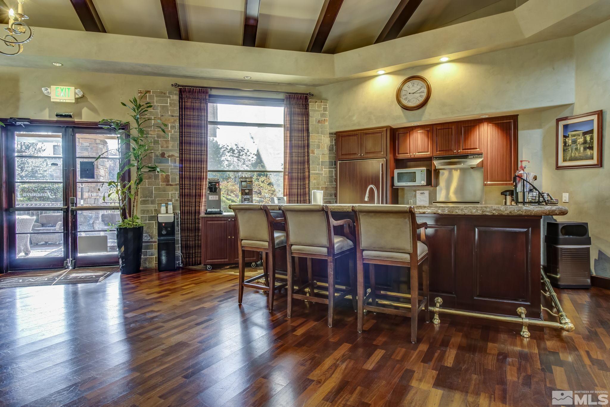 900 South Meadows Parkway, Unit 321 Reno, NV 89521 - Photo 29 of 40 a view of a dining room with furniture window and wooden floor