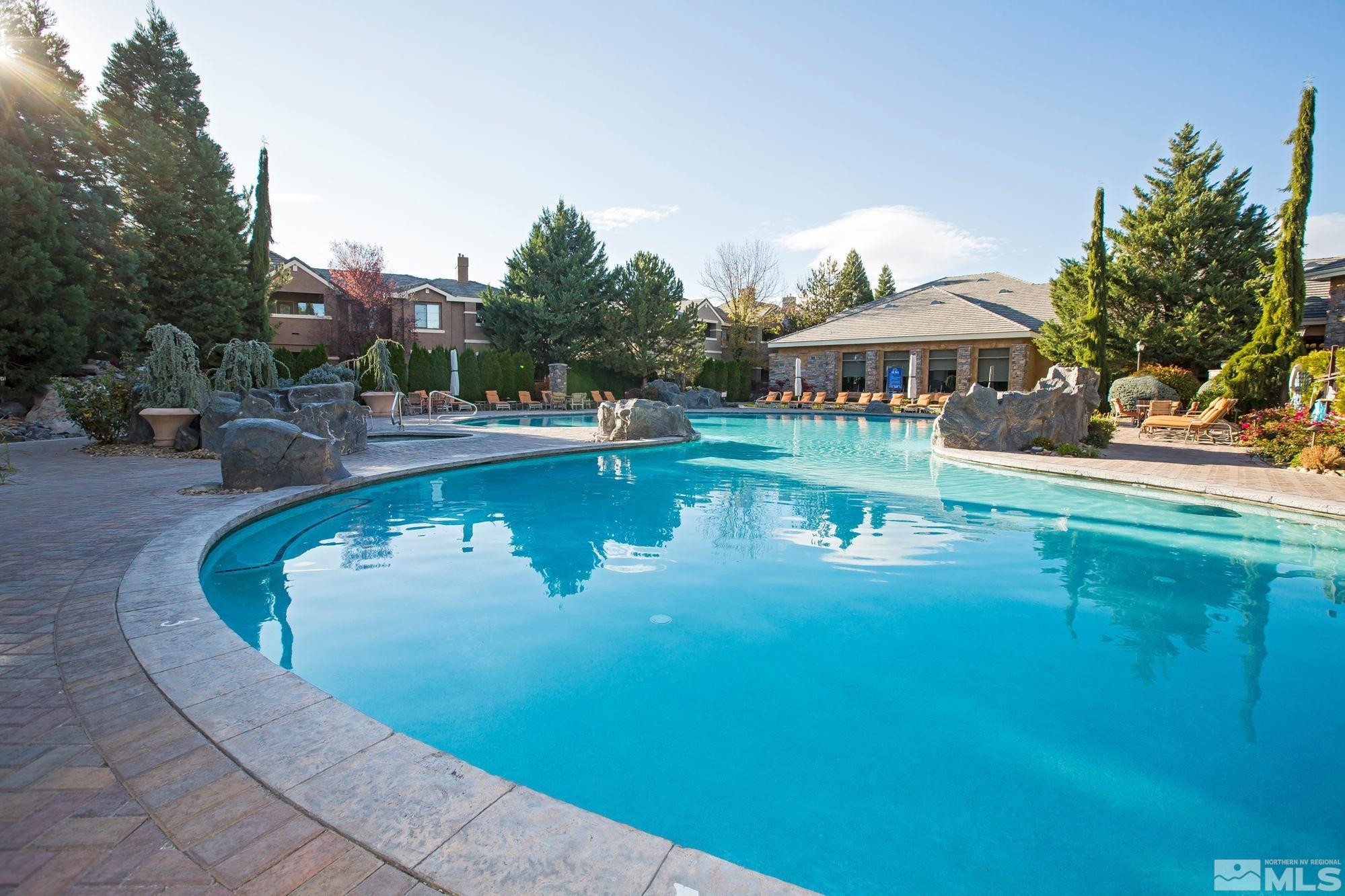 900 South Meadows Parkway, Unit 321 Reno, NV 89521 - Photo 37 of 40 a view of a swimming pool with lounge chair
