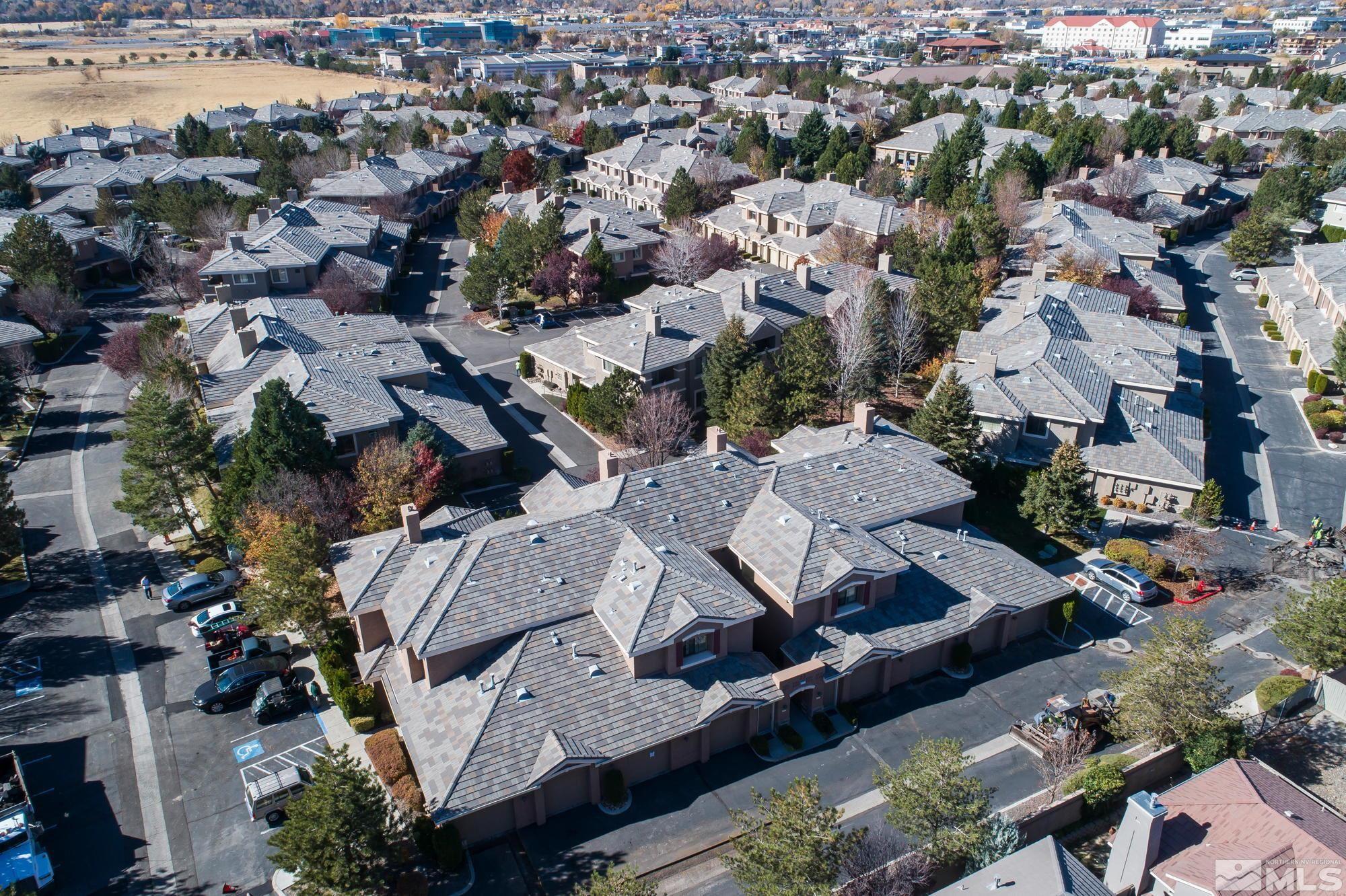900 South Meadows Parkway, Unit 321 Reno, NV 89521 - Photo 39 of 40 an aerial view of a city with lots of residential buildings