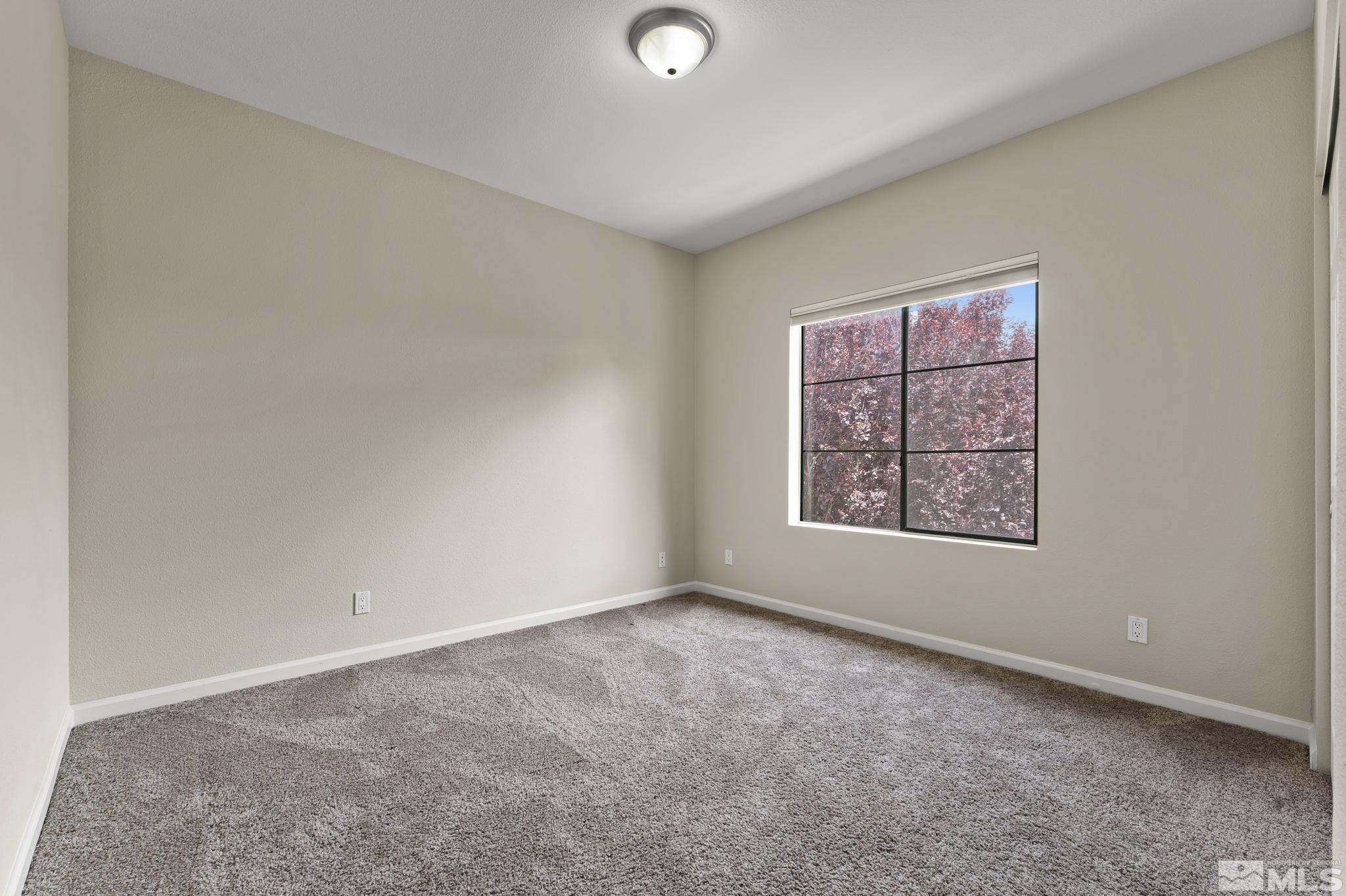 900 South Meadows Parkway, Unit 321 Reno, NV 89521 - Photo 8 of 40 an empty room with windows