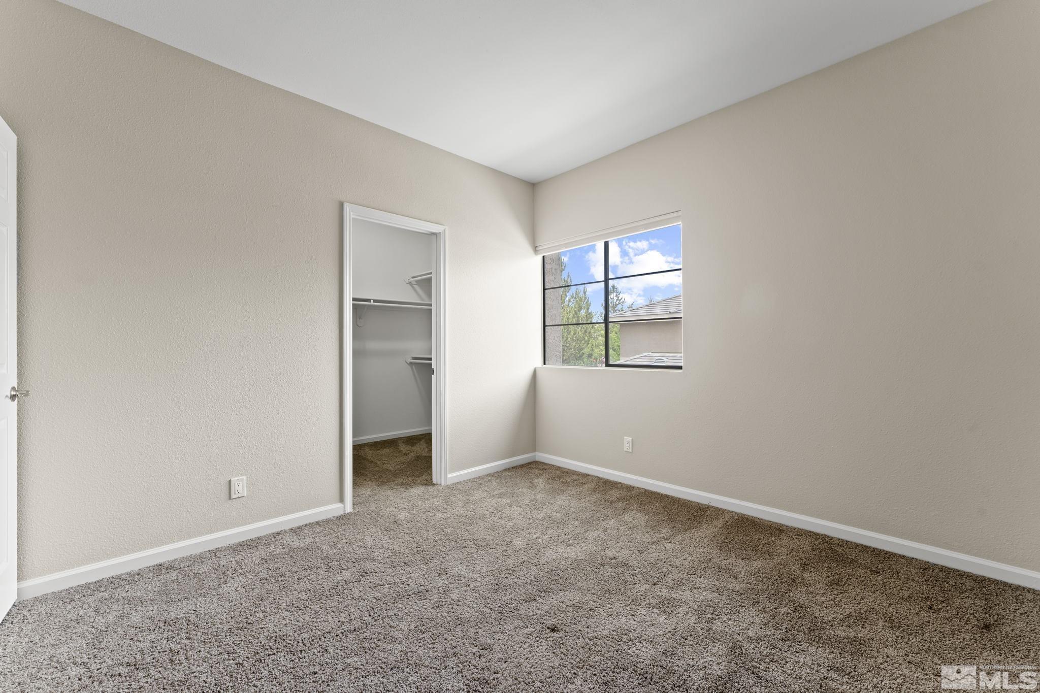 900 South Meadows Parkway, Unit 321 Reno, NV 89521 - Photo 10 of 40 an empty room with windows and closet