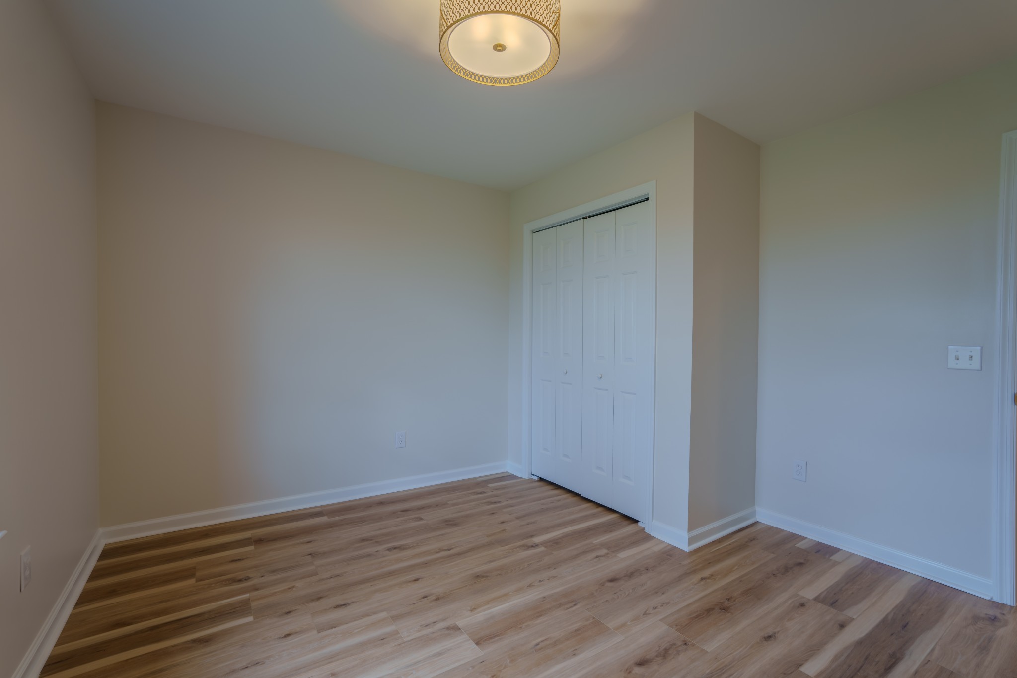 105 Peppertown Road Loretto, TN 38469 - Photo 19 of 37 a view of an empty room with wooden floor and a window