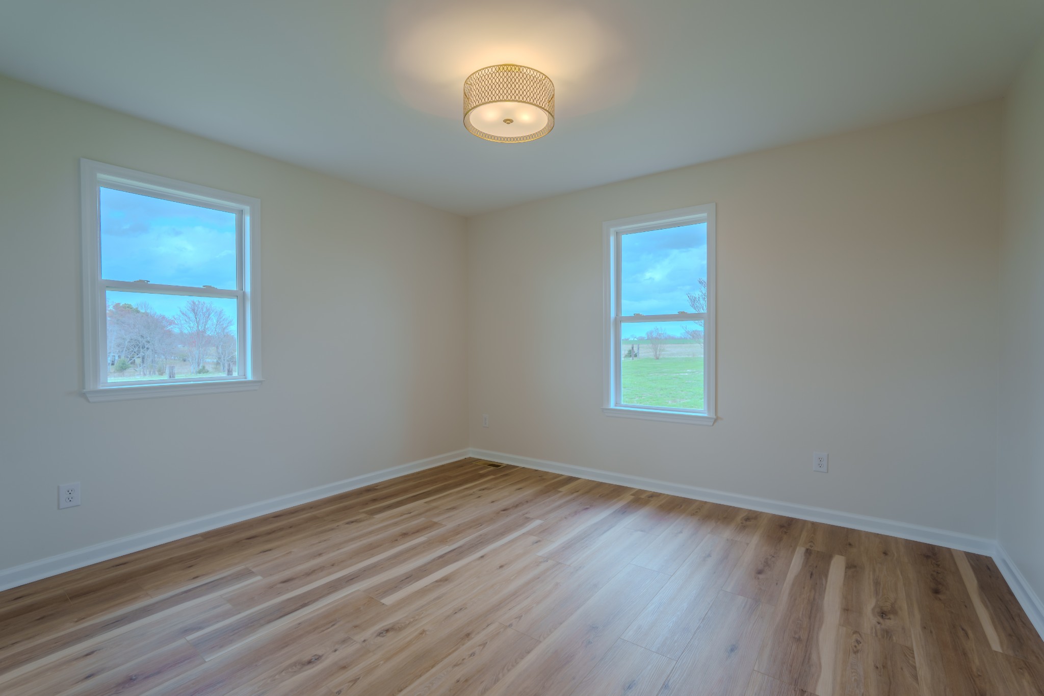 105 Peppertown Road Loretto, TN 38469 - Photo 20 of 37 a view of an empty room with wooden floor and a window