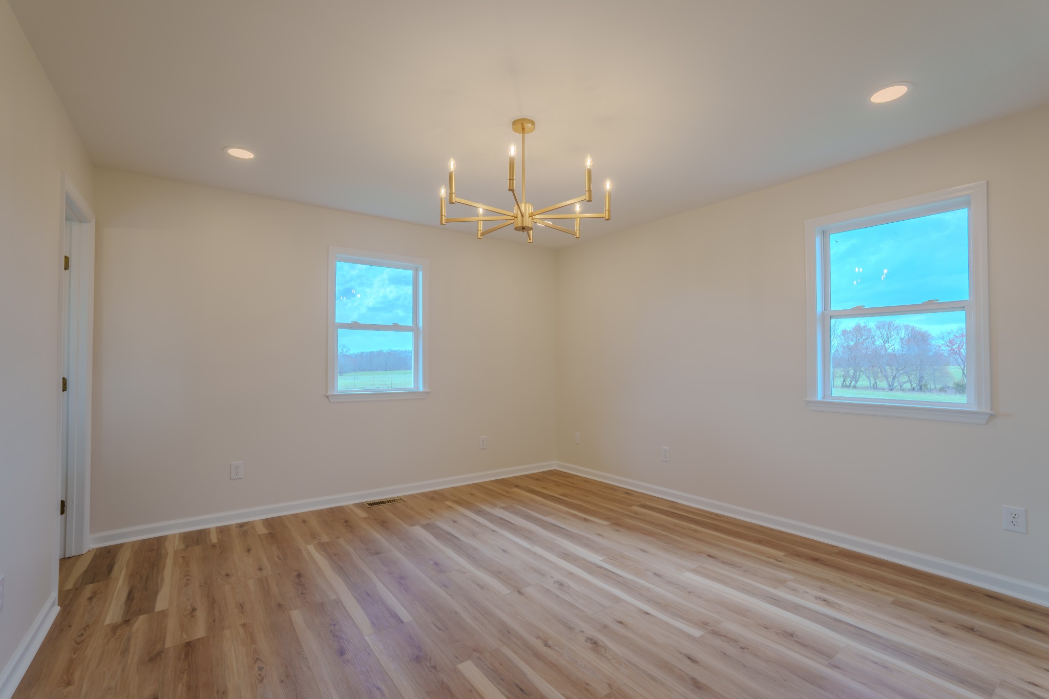 105 Peppertown Road Loretto, TN 38469 - Photo 22 of 37 a view of a room with wooden floor and chandelier