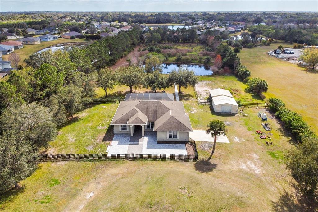 8915 Erie Road Parrish, FL 34219 - Photo 1 of 1 an aerial view of residential houses with outdoor space