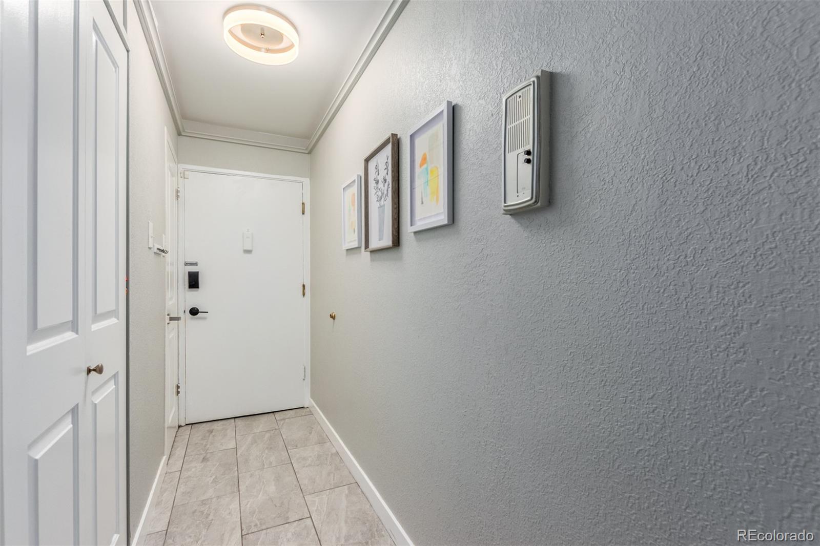 888 Logan Street, Unit 2F Denver, CO 80203 - Photo 7 of 16 a view of a hallway