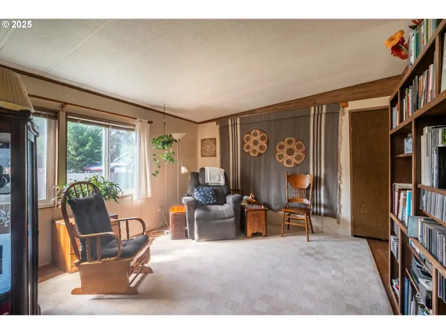 a kitchen with kitchen island granite countertop a sink cabinets and appliances