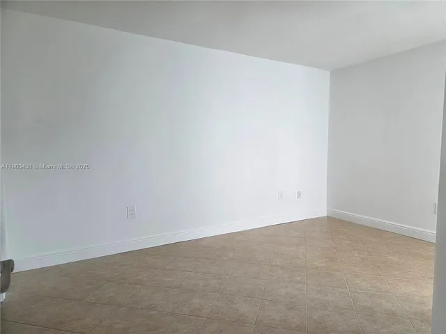 a bathroom with a double vanity sink toilet and a mirror