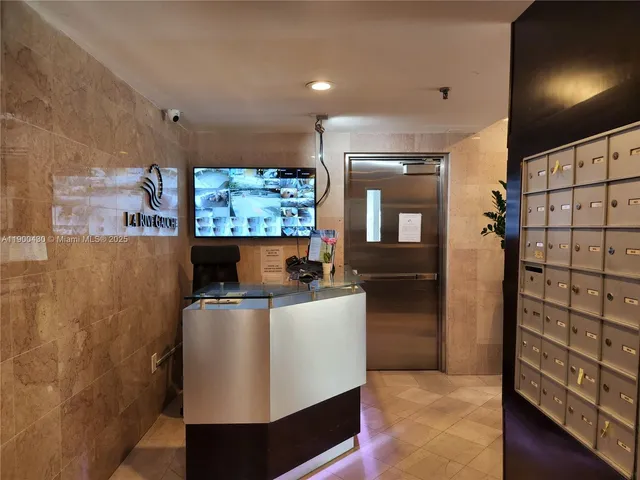 a view of a lake with couches chairs and a yard