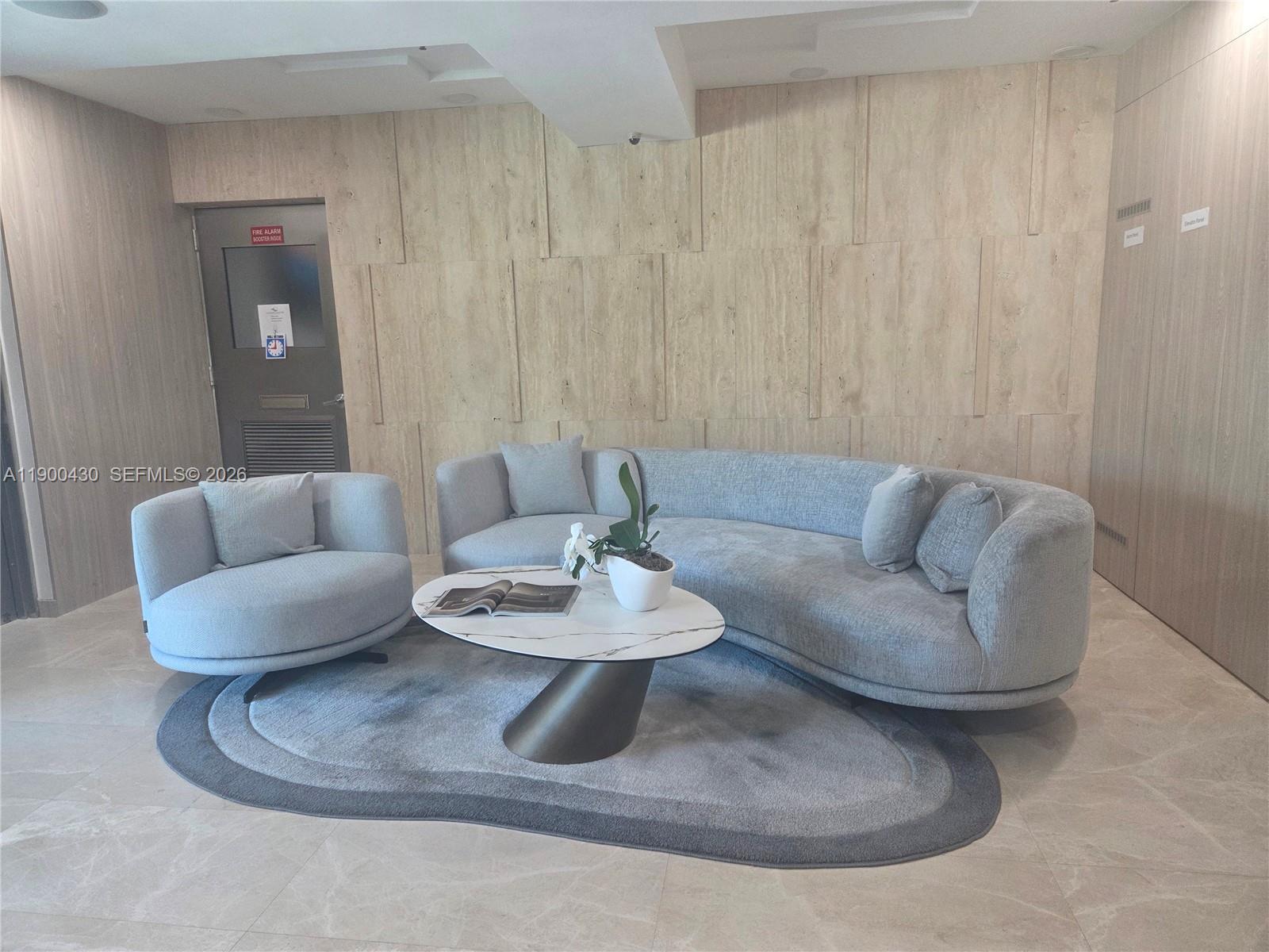 5880 Collins Avenue, Unit 806 Miami Beach, FL 33140 - Photo 19 of 30 a living room with furniture and a white area