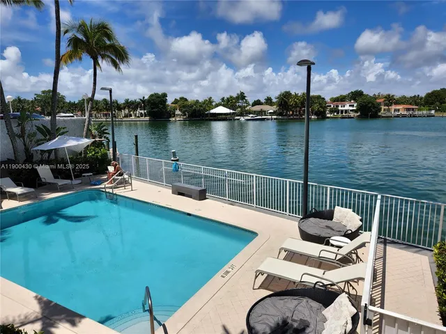 a view of a patio with dining table and chairs