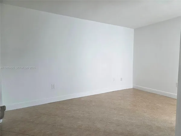 a bathroom with a double vanity sink toilet and a mirror