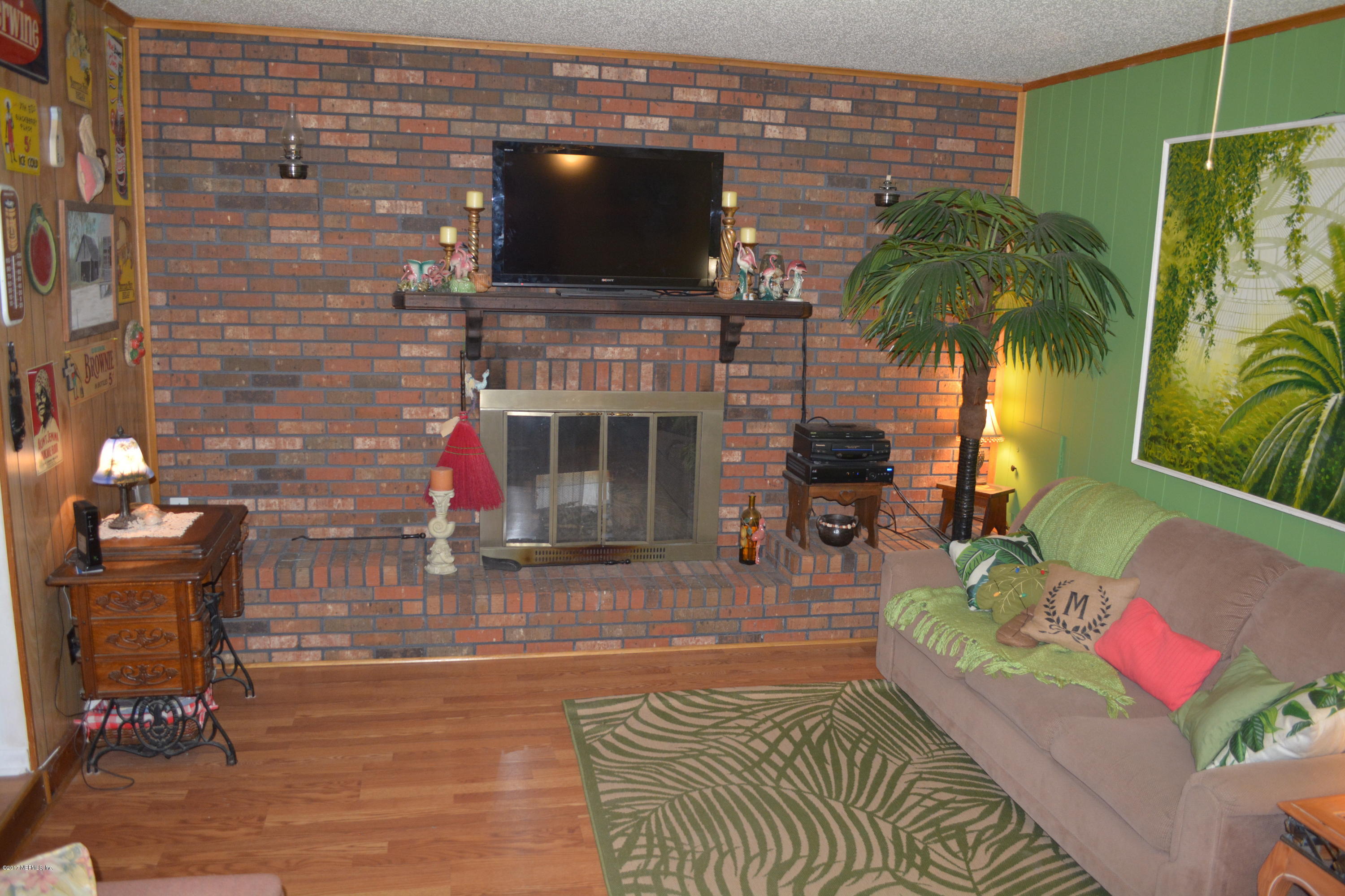 3599 North Canal Road Macclenny, FL 32063 - Photo 34 of 54 den fireplace wall