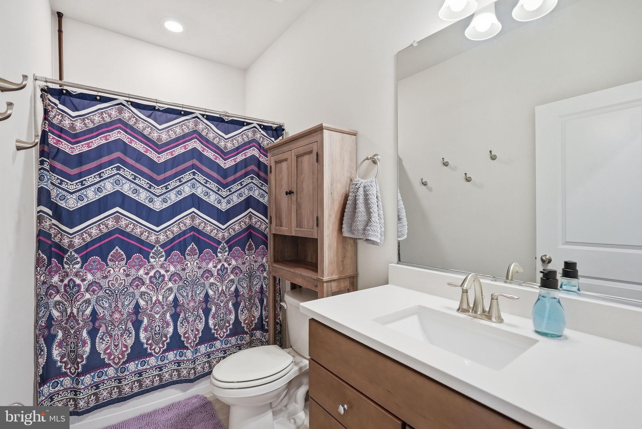 9365 Barnes Loop Manassas, VA 20110 - Photo 15 of 37 a bathroom with a sink and a mirror