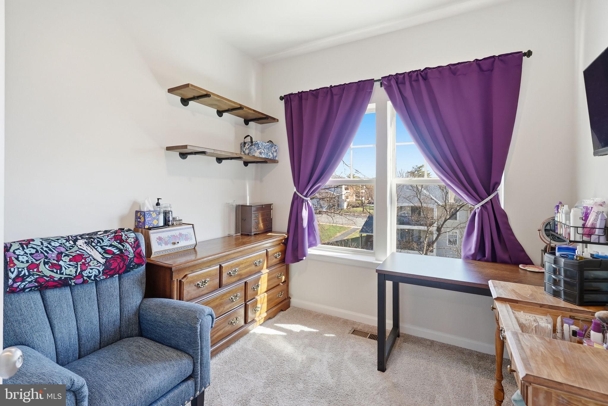 9365 Barnes Loop Manassas, VA 20110 - Photo 16 of 37 a living room with furniture a flat screen tv and a window