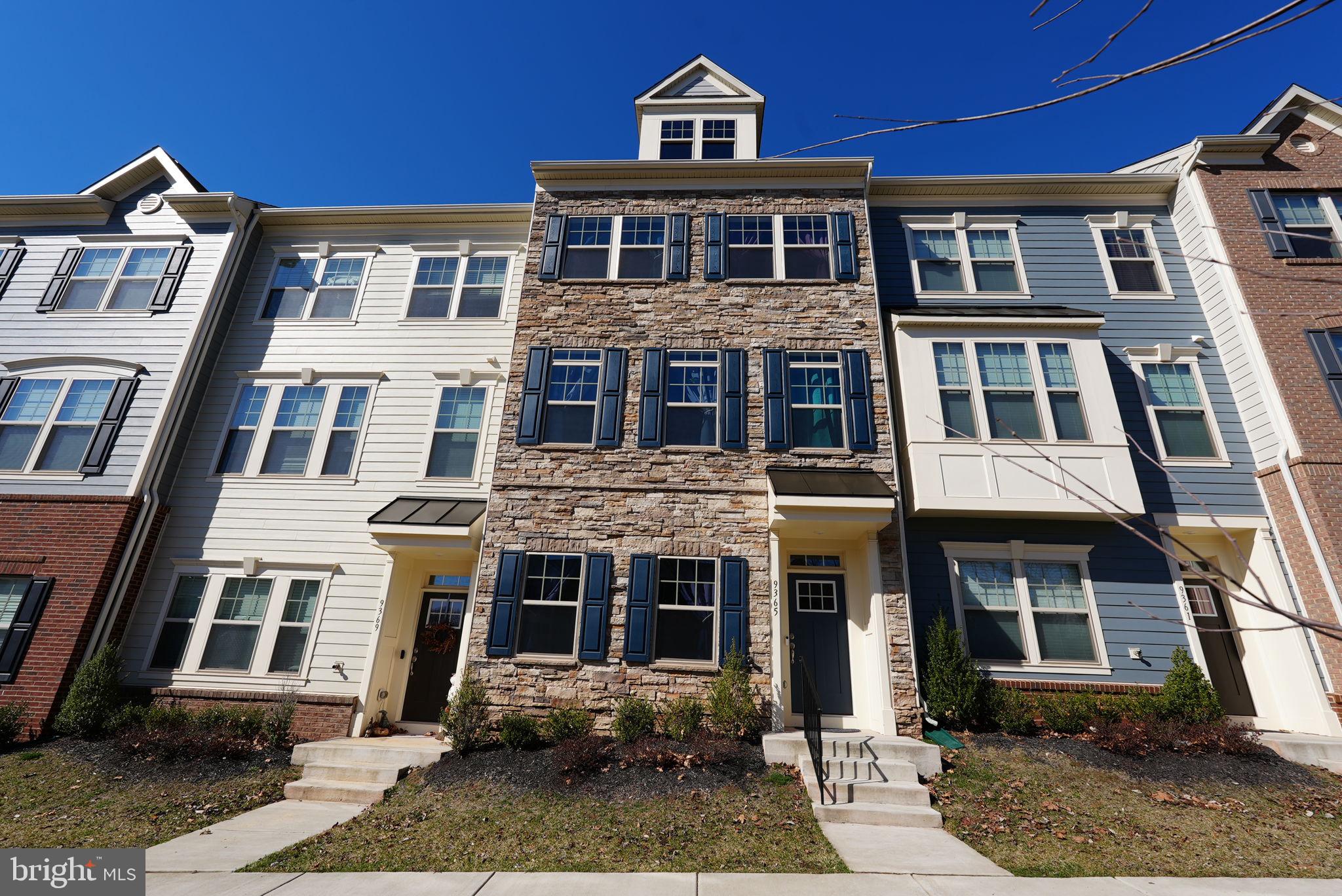 9365 Barnes Loop Manassas, VA 20110 - Photo 2 of 37 a front view of a house with a yard