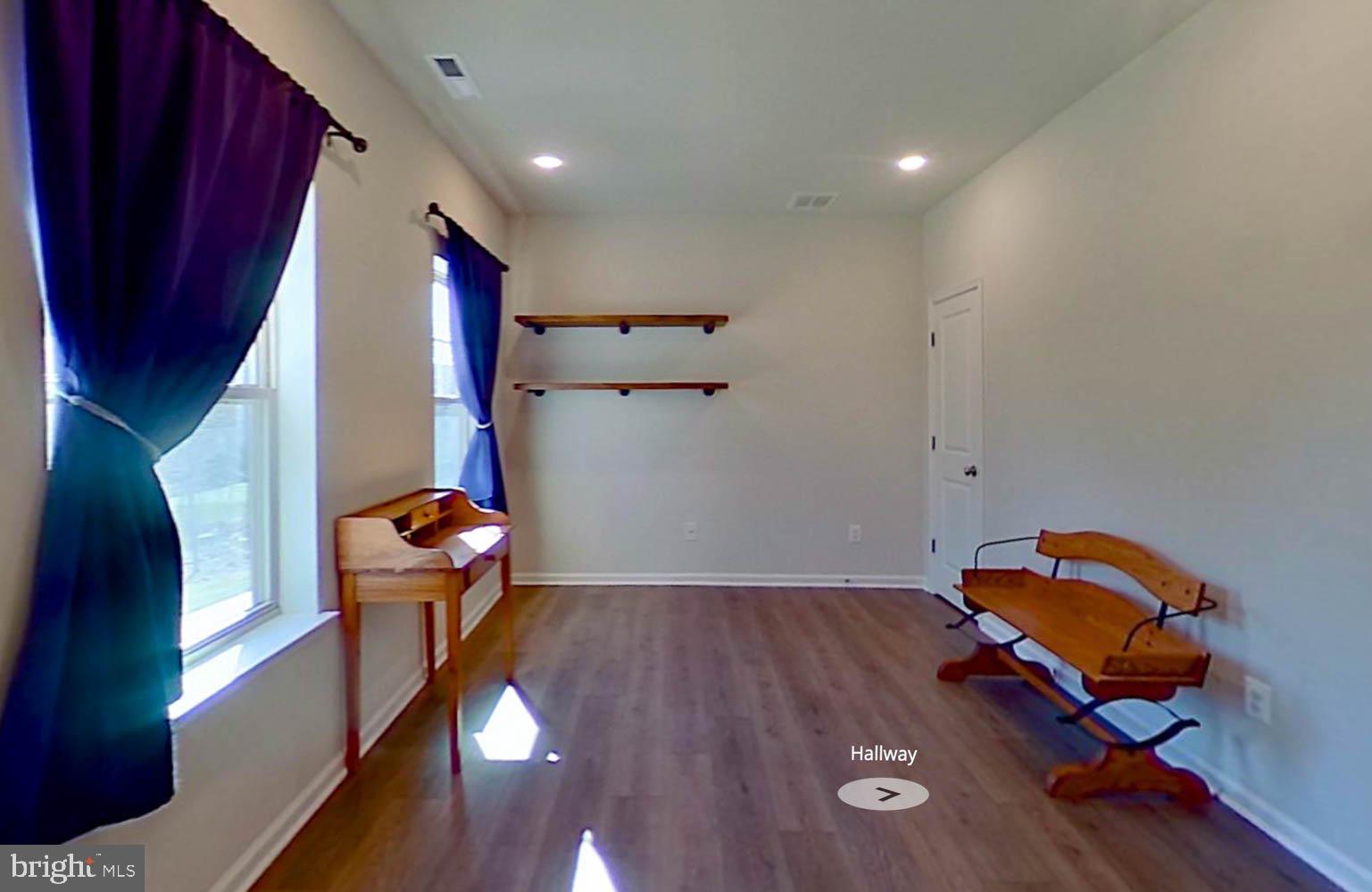 9365 Barnes Loop Manassas, VA 20110 - Photo 27 of 37 a living room with furniture and a mirror