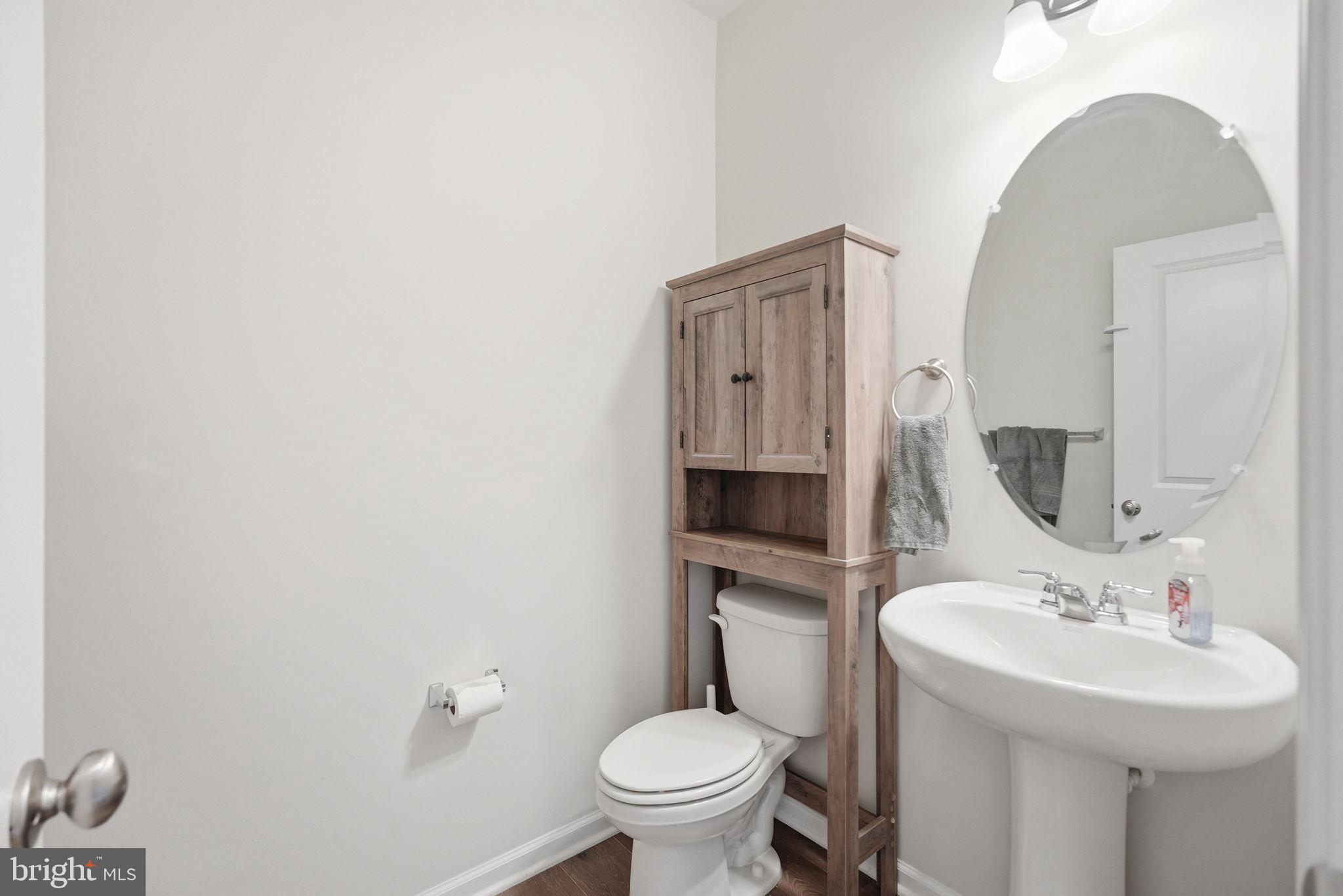 9365 Barnes Loop Manassas, VA 20110 - Photo 29 of 37 a bathroom with a toilet sink and mirror