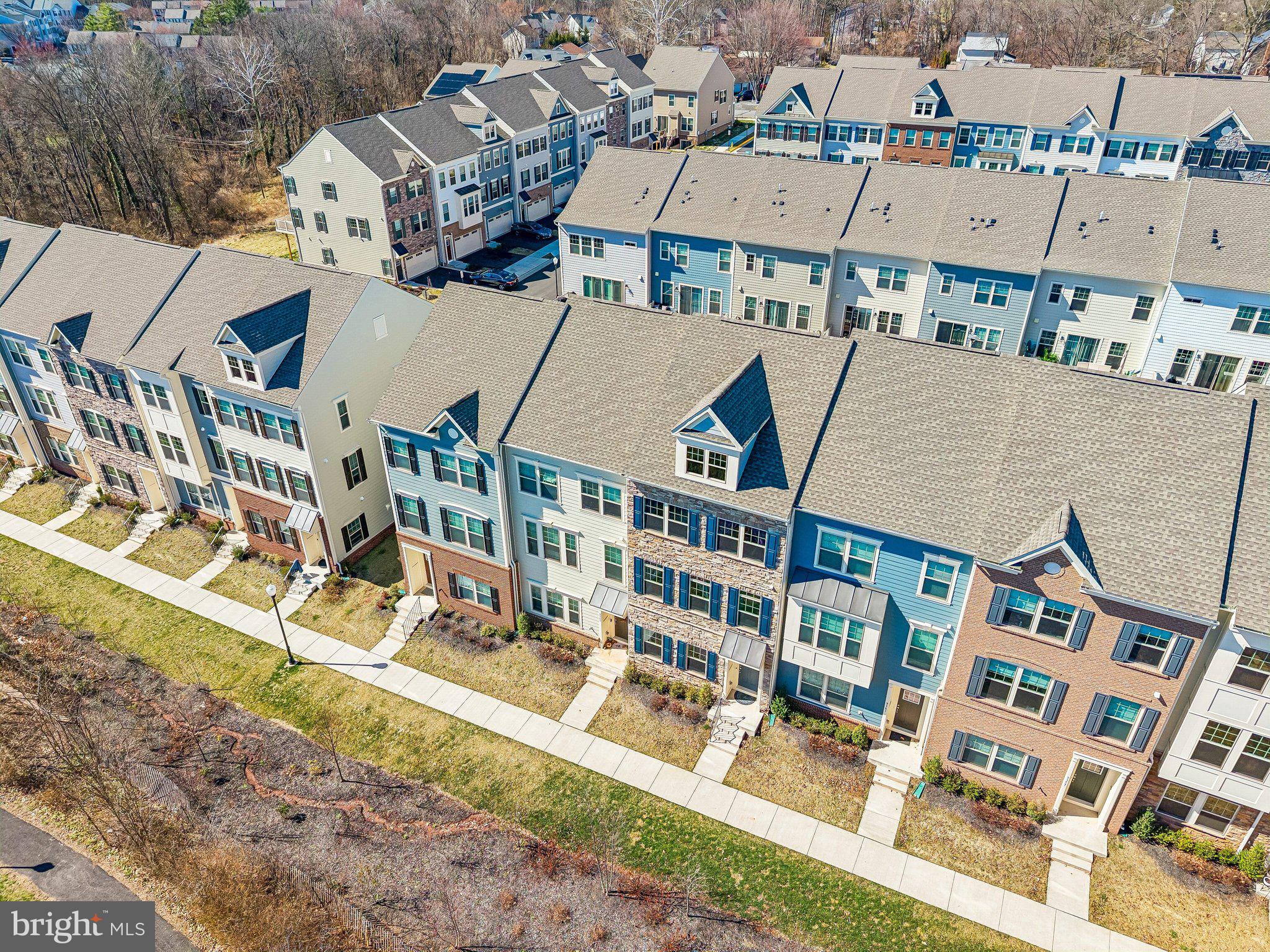 9365 Barnes Loop Manassas, VA 20110 - Photo 32 of 37 an aerial view of residential houses with outdoor space and parking
