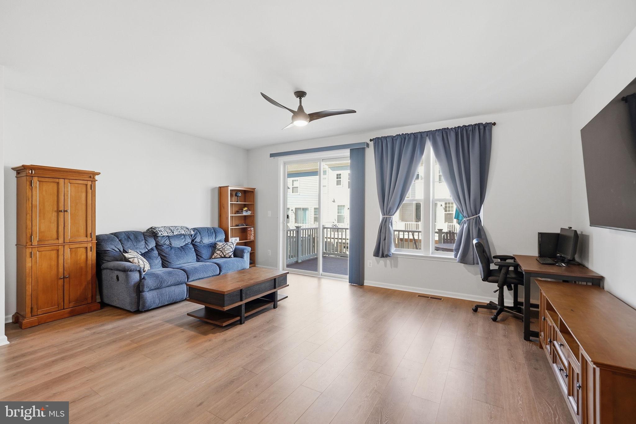 9365 Barnes Loop Manassas, VA 20110 - Photo 6 of 37 a living room with furniture and a flat screen tv