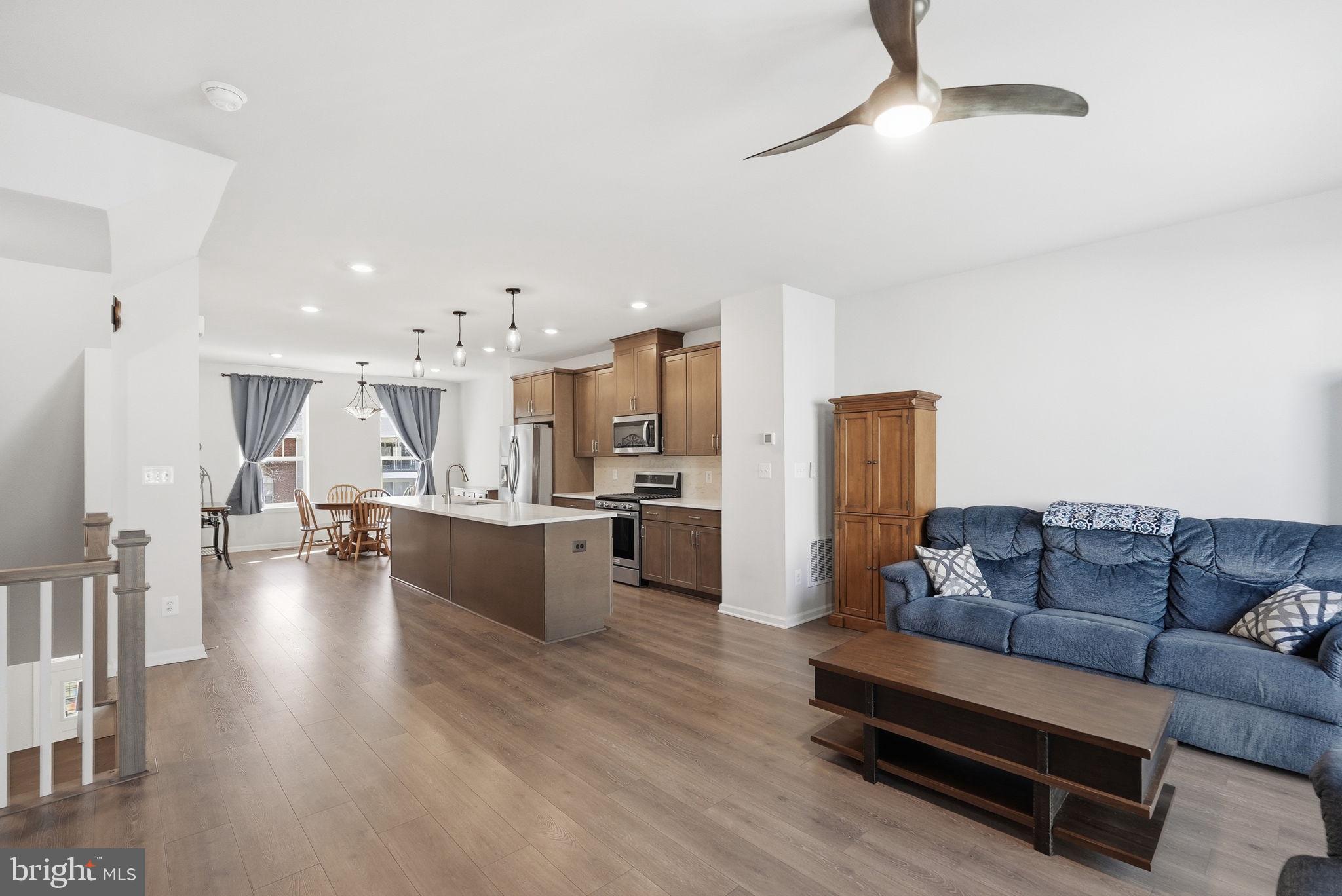 9365 Barnes Loop Manassas, VA 20110 - Photo 8 of 37 a living room with furniture and kitchen view