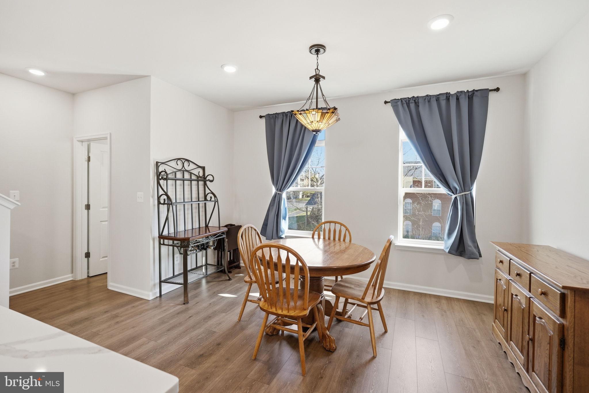 9365 Barnes Loop Manassas, VA 20110 - Photo 9 of 37 a view of a dining room with furniture window and wooden floor