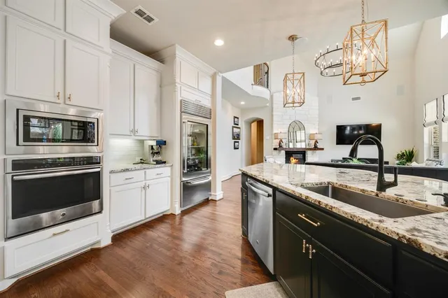 a kitchen with a sink stove and microwave