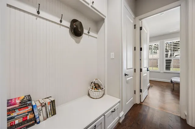 a view of a livingroom with furniture and hardwood floor