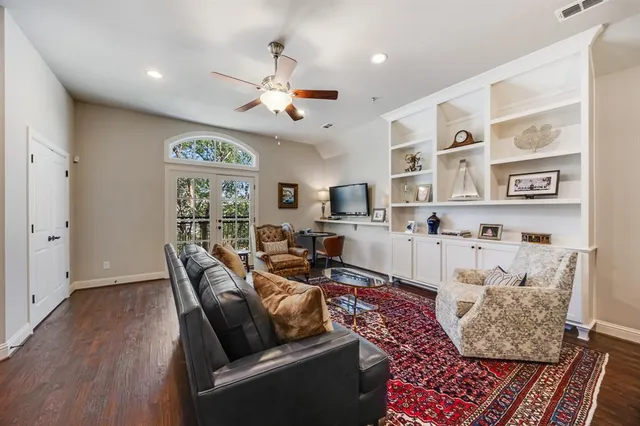 a living room with furniture and windows