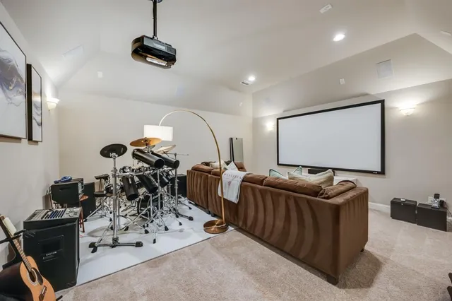 a room with gym equipment and a flat screen tv