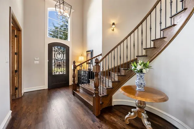 a view of entryway with wooden floor and stairs