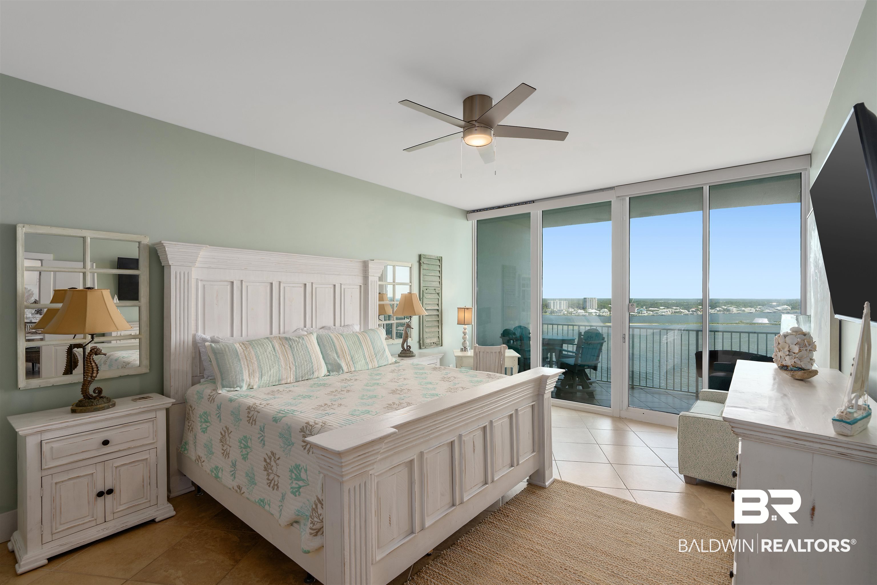 28107 Perdido Beach Boulevard, Unit DPH06 Orange Beach, AL 36561 - Photo 12 of 70 Tiled bedroom with a wall of windows, ceiling fan, and access to exterior