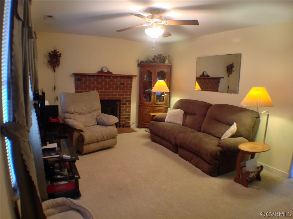 68 Rosebud Run Aylett, VA 23009 - Photo 16 of 50 Cozy living room with brick fireplace, wooden mant
