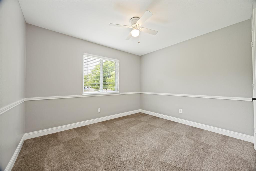 1601 Elm Street Anna, TX 75409 - Photo 20 of 25 an empty room with a window and a fan
